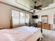 Spacious bedroom features a decorative ceiling, carpet and lots of natural light at 9347 Se 137Th Street Rd, Summerfield, FL 34491