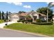 Charming home with well-manicured lawn, mature landscaping, and inviting curb appeal at 9347 Se 137Th Street Rd, Summerfield, FL 34491