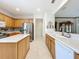 Kitchen featuring stainless steel appliances, island, and an open design concept at 9347 Se 137Th Street Rd, Summerfield, FL 34491