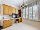 Bright office space featuring custom built-in cabinets, drawers, shelving and shuttered window at 9347 Se 137Th Street Rd, Summerfield, FL 34491