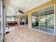 Enclosed lanai with tile floor and a beautiful golf course view at 9347 Se 137Th Street Rd, Summerfield, FL 34491