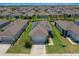 Aerial view of a single-Gathering home with a well-manicured lawn and solar panels at 9388 Sw 53Rd Pl, Ocala, FL 34481