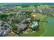 Beautiful aerial view of a community with tennis courts, community pool, and baseball field at 9388 Sw 53Rd Pl, Ocala, FL 34481