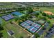 Aerial view of resort-style community amenities including tennis, baseball, and pickleball courts at 9388 Sw 53Rd Pl, Ocala, FL 34481