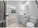 Modern bathroom featuring sleek vanity, updated fixtures, and a walk-in shower at 9388 Sw 53Rd Pl, Ocala, FL 34481