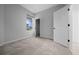 Bedroom boasting new carpet, a closet and an open doorway offering natural light and added ventilation at 9388 Sw 53Rd Pl, Ocala, FL 34481