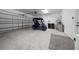 Spacious two car garage showcasing golf cart parking at 9388 Sw 53Rd Pl, Ocala, FL 34481