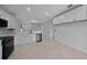 Open kitchen features stainless appliances, white cabinets and overlooks additional dining space at 9388 Sw 53Rd Pl, Ocala, FL 34481