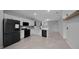 Modern kitchen features white cabinets, stainless steel appliances, and tile flooring at 9388 Sw 53Rd Pl, Ocala, FL 34481