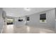 Bright living room features tile flooring and a seamless transition to the kitchen and outdoor patio area at 9388 Sw 53Rd Pl, Ocala, FL 34481