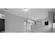 Spacious living area with recessed lighting, neutral paint, tile floors and sliding glass doors at 9388 Sw 53Rd Pl, Ocala, FL 34481