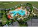 Aerial view of the community swimming pool with several people enjoying the water at 9388 Sw 53Rd Pl, Ocala, FL 34481