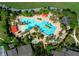 Aerial view of the community swimming pool with several people enjoying the water at 9388 Sw 53Rd Pl, Ocala, FL 34481