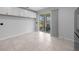 Versatile room features tile floors, neutral paint, and sliding glass door access to screened lanai at 9388 Sw 53Rd Pl, Ocala, FL 34481