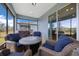 Screened patio features comfortable seating area, perfect for enjoying the outdoors at 9388 Sw 53Rd Pl, Ocala, FL 34481