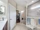 Bathroom with walk-in closet and glass-enclosed shower offering style and function at 9740 Sw 68Th Ln, Ocala, FL 34481