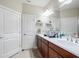 Bright bathroom featuring double sinks, generous counter space, and ample storage at 9740 Sw 68Th Ln, Ocala, FL 34481