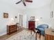 Cozy bedroom featuring hardwood floors, neutral walls, and an abundance of natural light at 9740 Sw 68Th Ln, Ocala, FL 34481