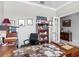 Spacious home office with a large desk, a stylish bookshelf, and tasteful decor at 9740 Sw 68Th Ln, Ocala, FL 34481