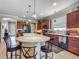 A modern kitchen features a large island with seating and stainless steel appliances at 9740 Sw 68Th Ln, Ocala, FL 34481