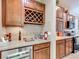 A stylish kitchen with a wine rack, granite countertops, and stainless steel appliances at 9740 Sw 68Th Ln, Ocala, FL 34481