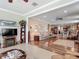 Spacious living room with stylish furnishings that flows into the kitchen and dining area at 9740 Sw 68Th Ln, Ocala, FL 34481