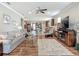 Bright and open living room with hardwood floors and seamless flow to the kitchen at 9740 Sw 68Th Ln, Ocala, FL 34481