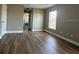 Bedroom featuring wood floors, a window, and neutral wall color at 9934 Se 64Th Ave, Belleview, FL 34420