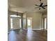 The foyer boasts gleaming hardwood floors and a modern chandelier at 9934 Se 64Th Ave, Belleview, FL 34420