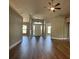 The foyer boasts gleaming hardwood floors, vaulted ceilings, and a modern chandelier at 9934 Se 64Th Ave, Belleview, FL 34420
