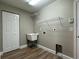 Practical laundry room features a utility sink and wire rack storage at 9934 Se 64Th Ave, Belleview, FL 34420
