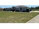 Beautiful single story home featuring manicured lawn and mature shrubbery at 9934 Se 64Th Ave, Belleview, FL 34420