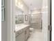Well-lit bathroom with a double sink vanity, shower with glass door, and neutral color scheme for a serene atmosphere at 10033 Sw 96Th St, Ocala, FL 34481