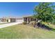 Charming single-story home featuring a well-manicured lawn and inviting front porch at 10033 Sw 96Th St, Ocala, FL 34481