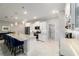 Bright kitchen with white cabinets, stainless steel appliances, ample counter space, and stylish backsplash at 10033 Sw 96Th St, Ocala, FL 34481