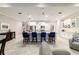 Spacious kitchen featuring a large island with seating, stainless steel appliances, and ample cabinet space at 10033 Sw 96Th St, Ocala, FL 34481