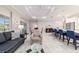Open floor plan showcasing a bright kitchen and comfortable living area, perfect for entertaining at 10033 Sw 96Th St, Ocala, FL 34481