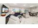 Comfortable living area with lots of natural light, a large window and access to the backyard at 10033 Sw 96Th St, Ocala, FL 34481