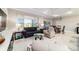 Bright living area featuring modern furnishings and large windows, complemented by stylish interior decor at 10033 Sw 96Th St, Ocala, FL 34481