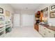 Versatile room with white tile, ideal for use as an office or flex space, featuring lots of storage at 10033 Sw 96Th St, Ocala, FL 34481