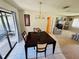 Well-lit dining room with tile floors and a view of the living room at 10081 Sw 93Rd Ave, Ocala, FL 34481