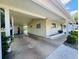 Charming single-story home boasts a covered carport and meticulous landscaping, creating curb appeal and outdoor functionality at 10081 Sw 93Rd Ave, Ocala, FL 34481