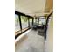 Covered patio with screen windows and ceiling fan at 10081 Sw 93Rd Ave, Ocala, FL 34481