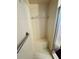 Tiled shower featuring a built-in seat, grab bar, and glass door at 10081 Sw 93Rd Ave, Ocala, FL 34481