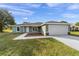 A charming single-story home with a two-car garage and inviting curb appeal at 10785 Sw 130Th Ct, Dunnellon, FL 34432