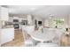 Bright open-concept kitchen featuring an island and stainless appliances connected to the living room at 10869 Sw 140Th Ave, Dunnellon, FL 34432