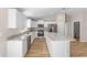 Modern kitchen featuring an island, sleek appliances, and beautiful stone countertops at 10869 Sw 140Th Ave, Dunnellon, FL 34432