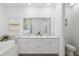 Elegant bathroom with a double vanity, soaking tub, and a separate shower, providing a luxurious feel at 1119 Se 42Nd Rd, Ocala, FL 34480