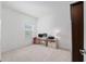 Bright bedroom with a desk, computer, and view of a sunny window at 1119 Se 42Nd Rd, Ocala, FL 34480
