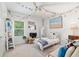 Bright bedroom with a cozy bed, decorations, and a sunny window view at 1119 Se 42Nd Rd, Ocala, FL 34480